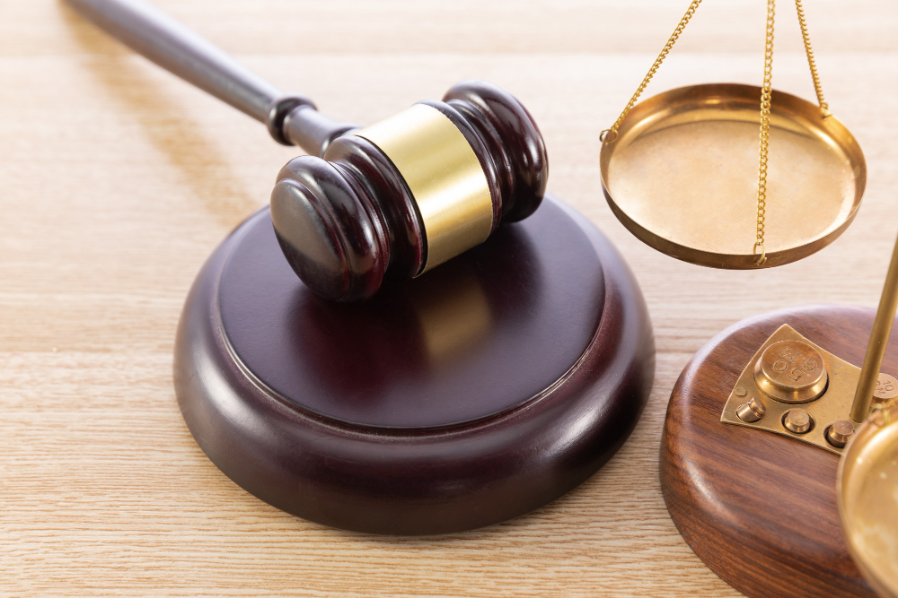 high-angle-shot-gavel-scale-wooden-surface
